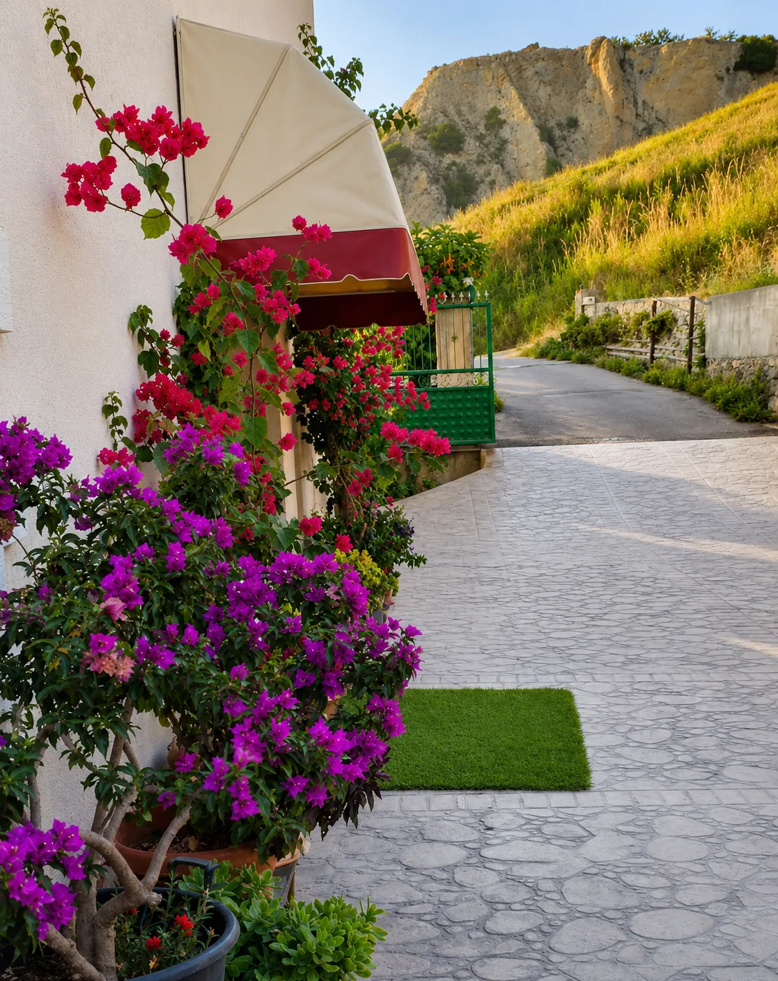 Flower-lined road from Eldo Apartments toward the beach